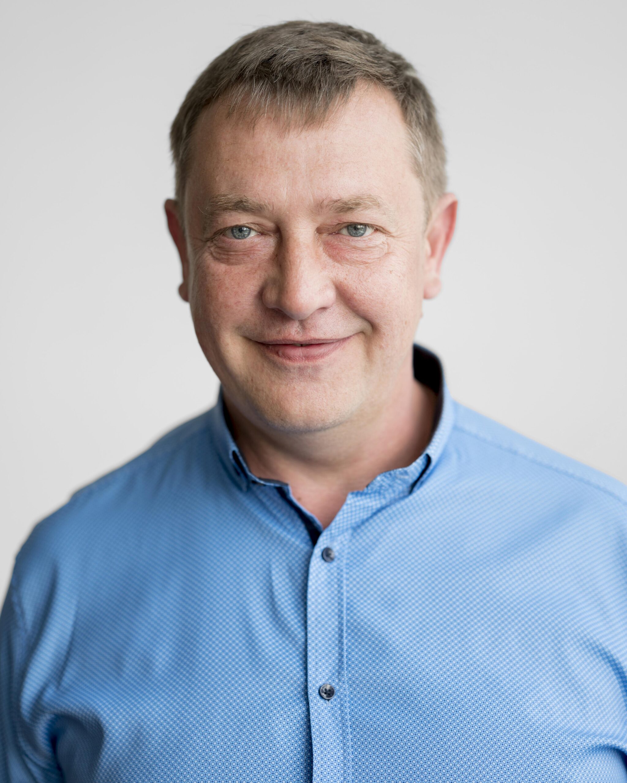 portrait man with blue shirt